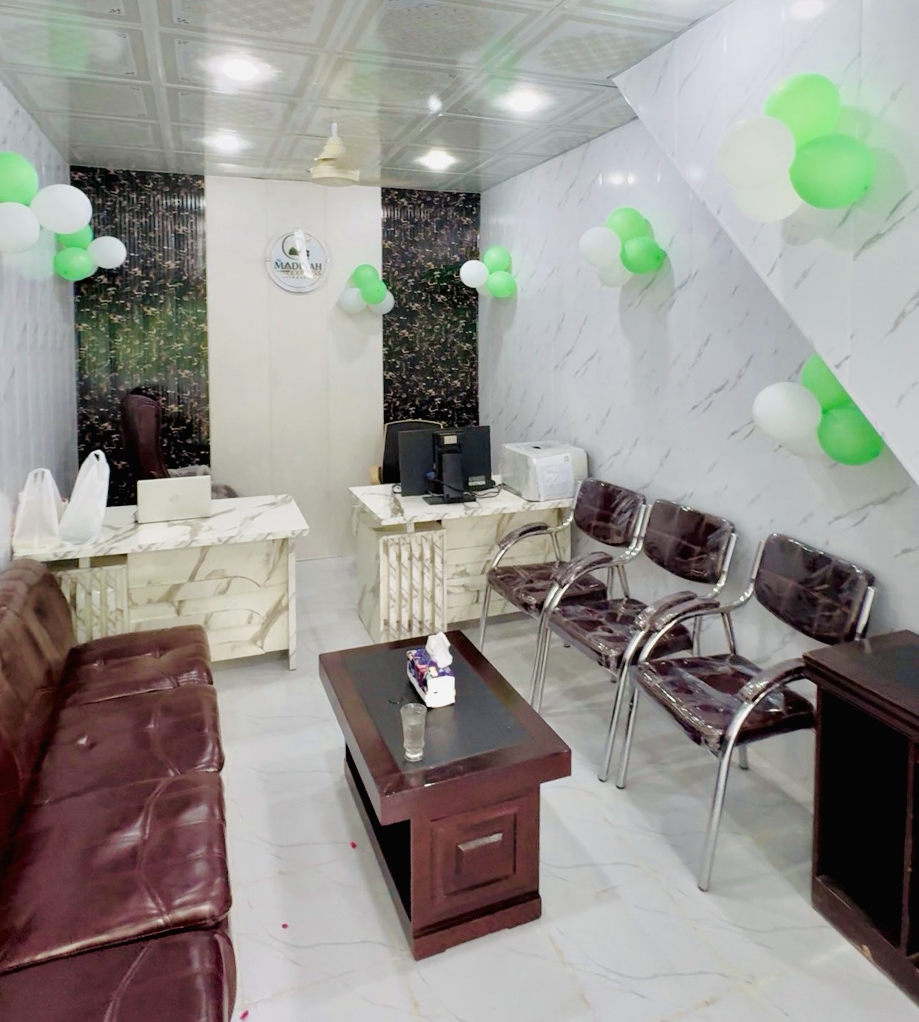 Inside the Al Madinah Express Travel office in Sargodha